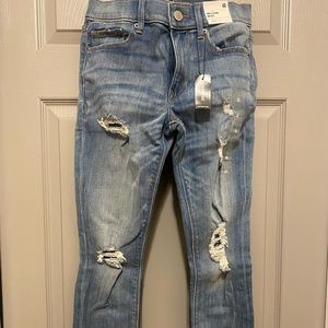 Brand new EXPRESS ANKLE mid rise stretchy ripped jeans.